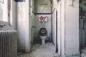 toilet with graffiti